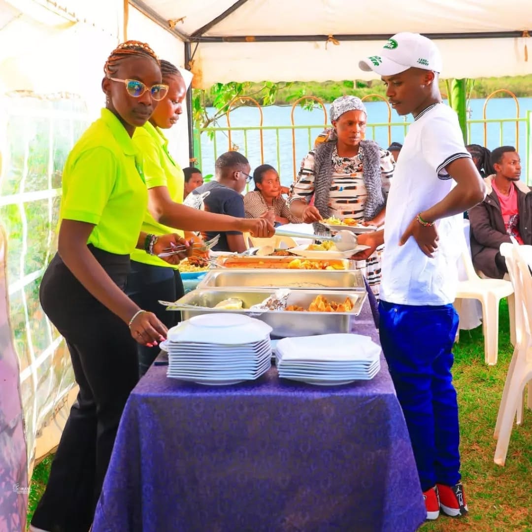 Happy graduate celebrating with family at an outdoor party